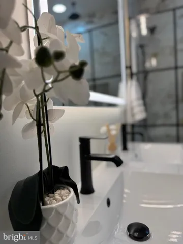 a kitchen with white cabinets and appliances