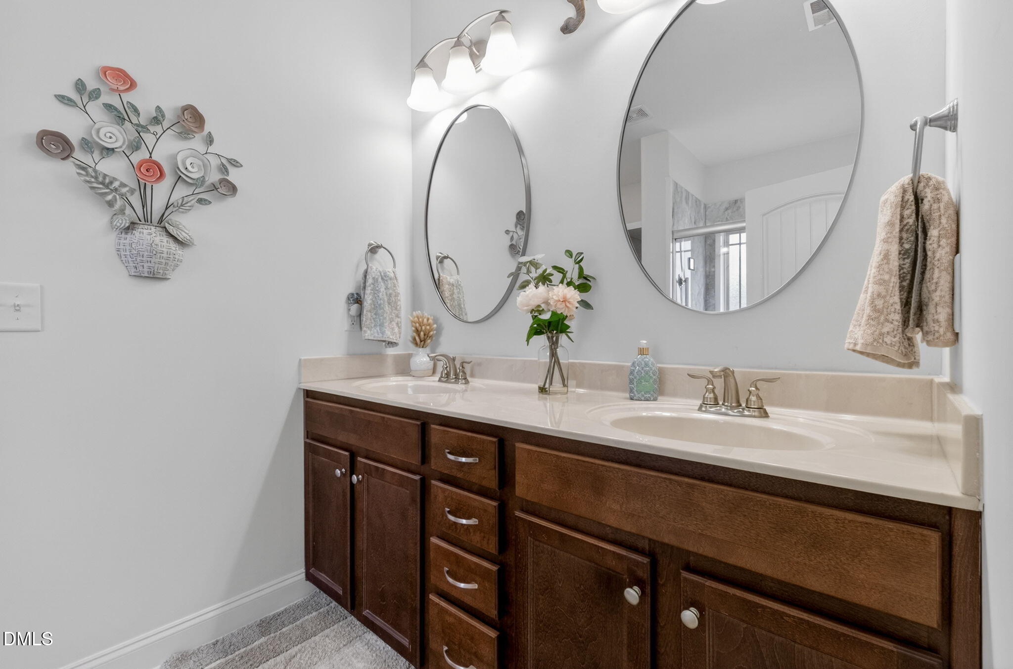 20 Deep Clay Circle Angier, NC 27501 - Photo 30 of 54 a bathroom with a double vanity sink and a mirror