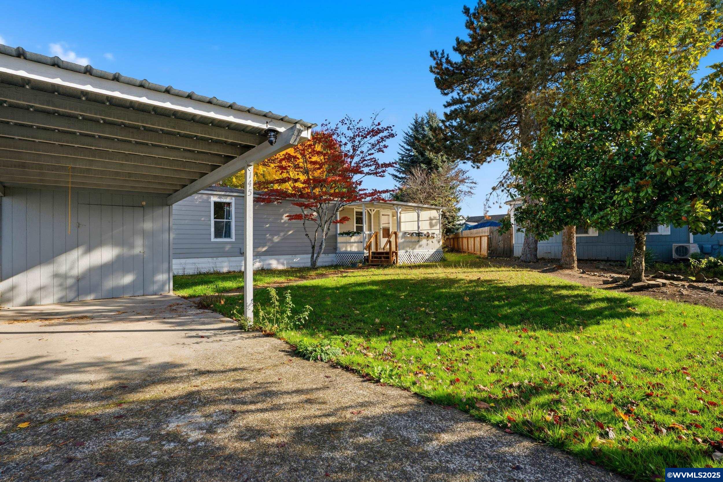 277 Edwards Road, Unit 145 Monmouth, OR 97361 - Photo 45 of 47 a view of a house with backyard and porch