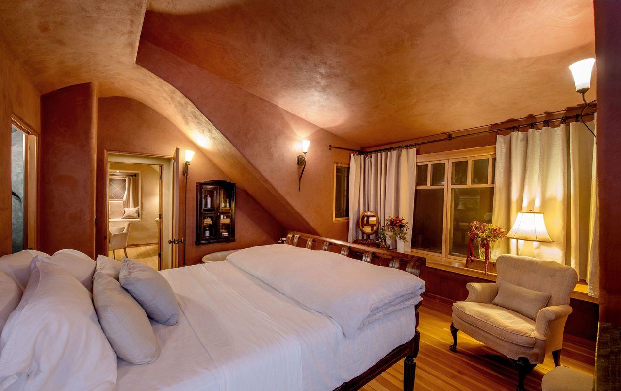 1069 Summit Road Watsonville, CA 95076 - Photo 28 of 50 a bed room with a bed and a chair