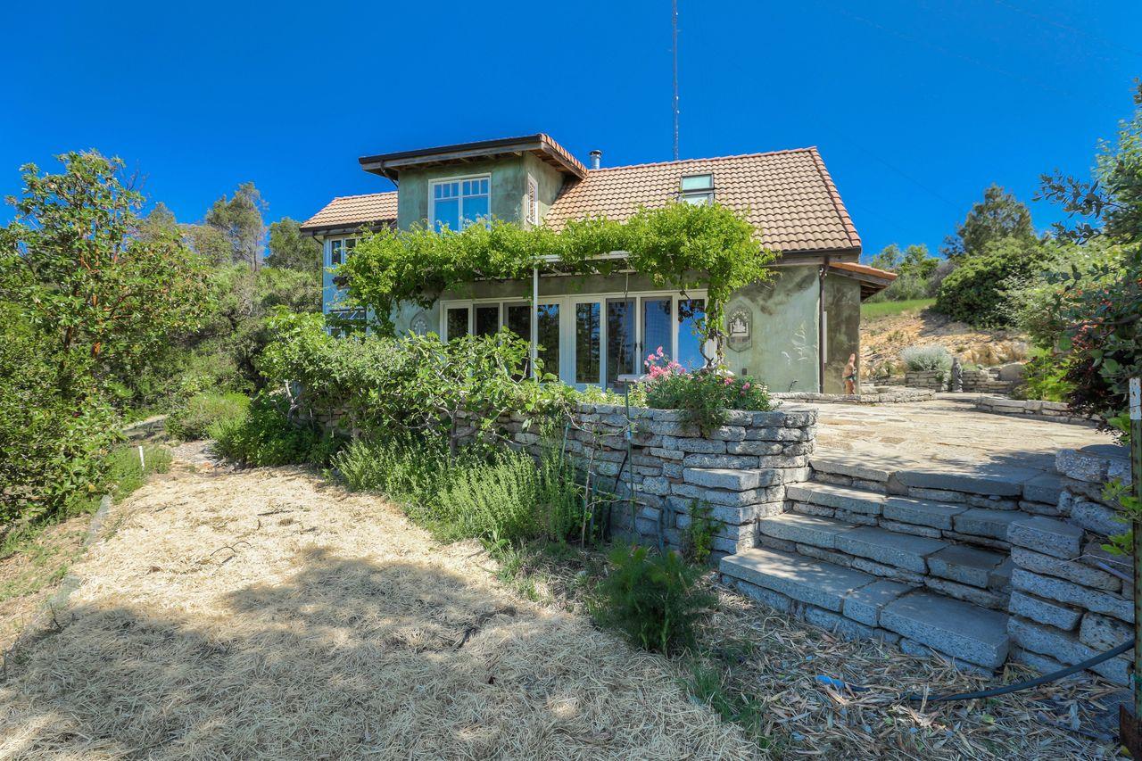 1069 Summit Road Watsonville, CA 95076 - Photo 3 of 50 a front view of a house with garden