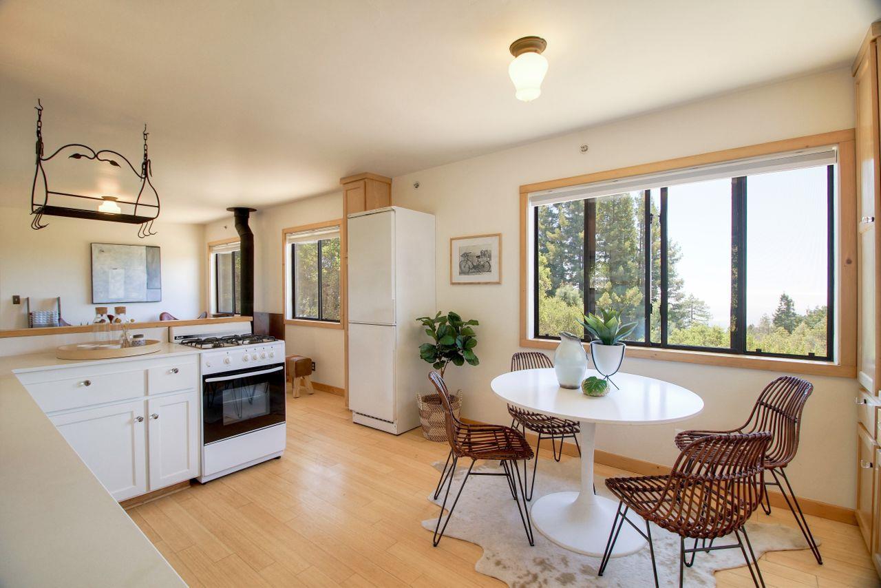 1069 Summit Road Watsonville, CA 95076 - Photo 40 of 50 a kitchen with stainless steel appliances a dining table and chairs