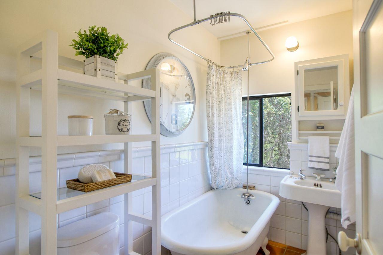 1069 Summit Road Watsonville, CA 95076 - Photo 45 of 50 a bathroom with a sink a mirror and a shower