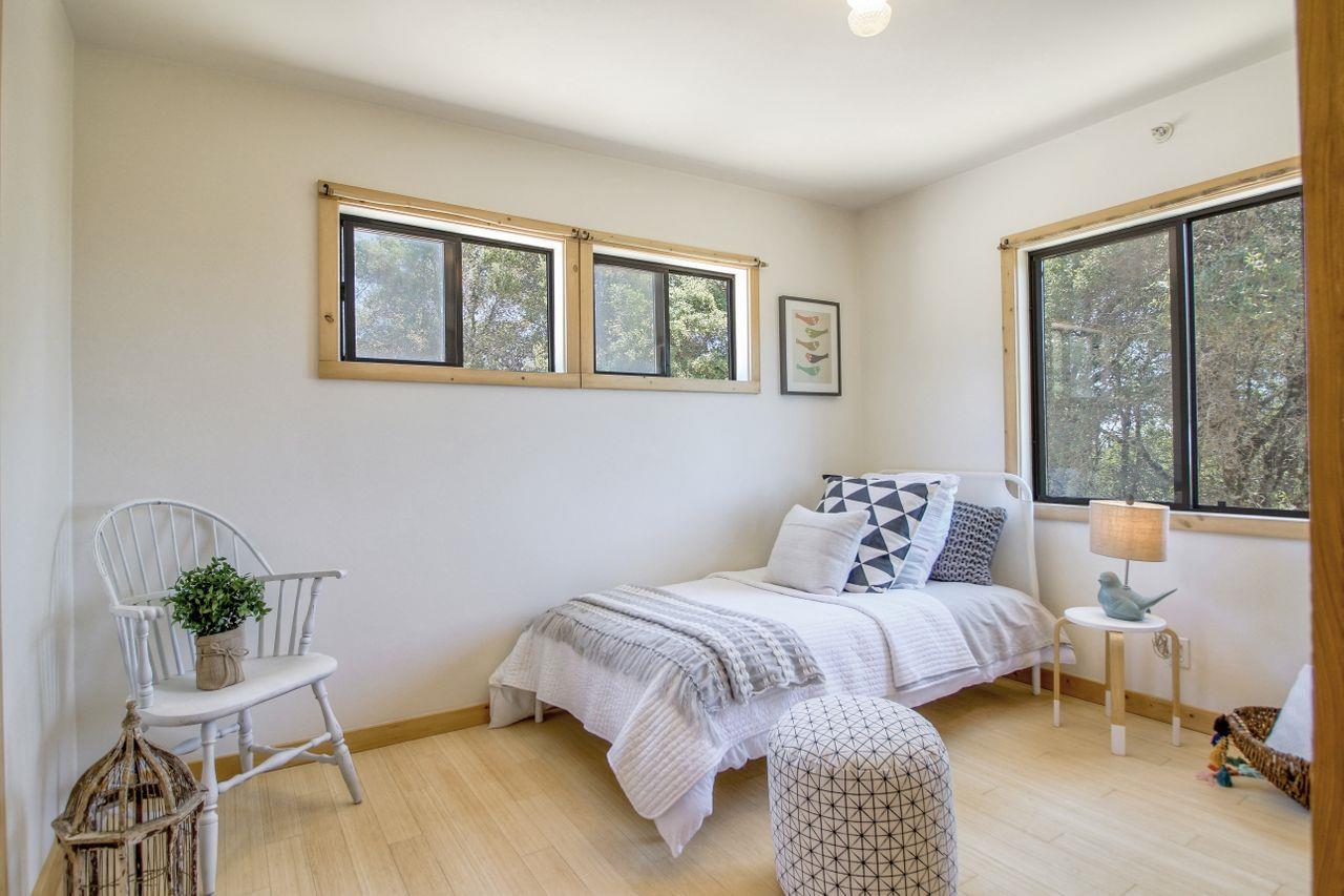 1069 Summit Road Watsonville, CA 95076 - Photo 46 of 50 a bedroom with a large bed and a table