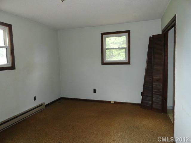 1420 Barger Road Salisbury, NC 28146 - Photo 2 of 7 an empty room with windows