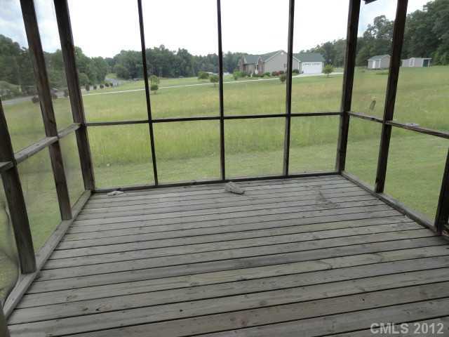 1420 Barger Road Salisbury, NC 28146 - Photo 4 of 7 a view of a deck with a floor to ceiling window stairs