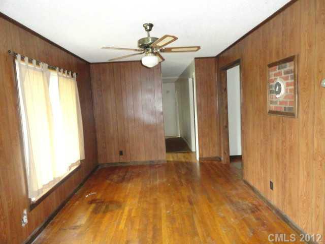 1420 Barger Road Salisbury, NC 28146 - Photo 6 of 7 a view of an empty room with wooden floor and a window