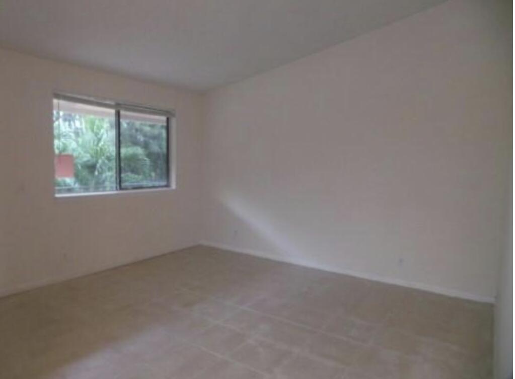 200 Nottingham Circle, Unit J Greenacres, FL 33463 - Photo 5 of 12 an empty room with a window