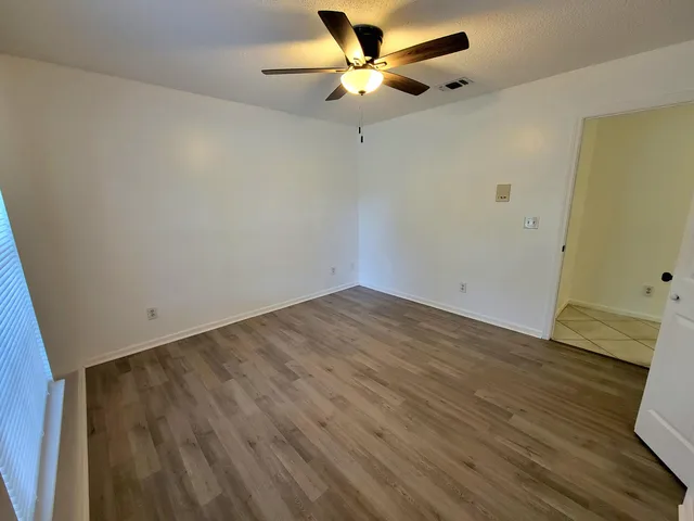 a view of a big room with wooden floor