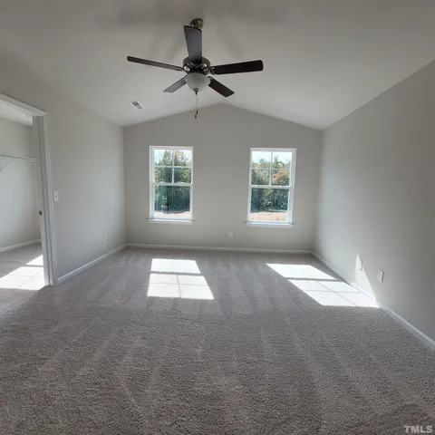 a view of empty room with windows