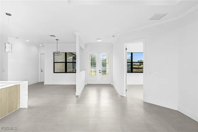 a view of a kitchen with a sink and a refrigerator