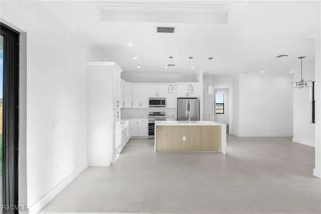 a view of kitchen and kitchen with a sink