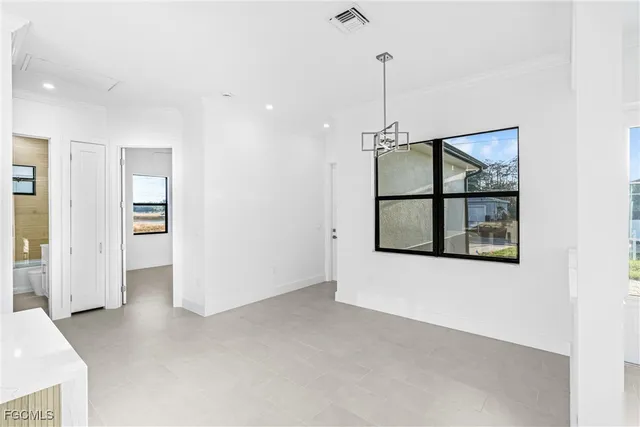 a view of a room with a flat screen tv and a window