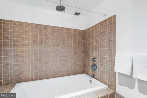 a bathroom with a white bath tub