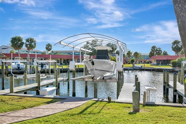 a view of a swimming pool with a patio and yard
