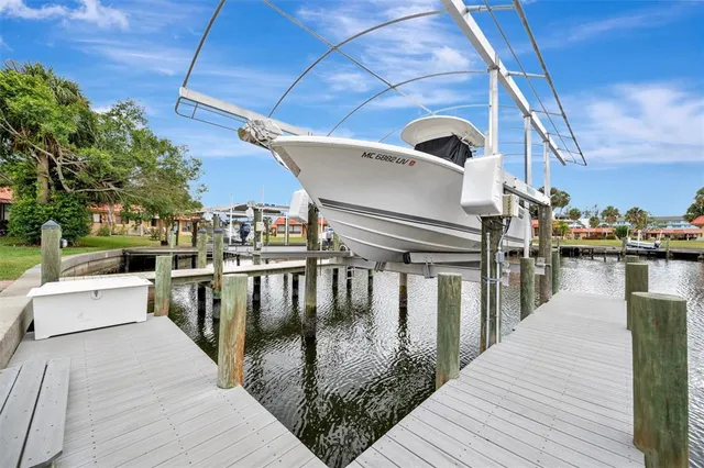 a room with pool table and windows