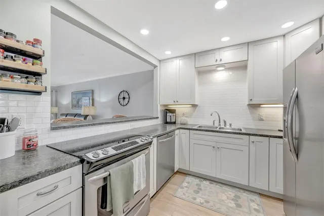 a view of a livingroom with workspace and a bookshelf