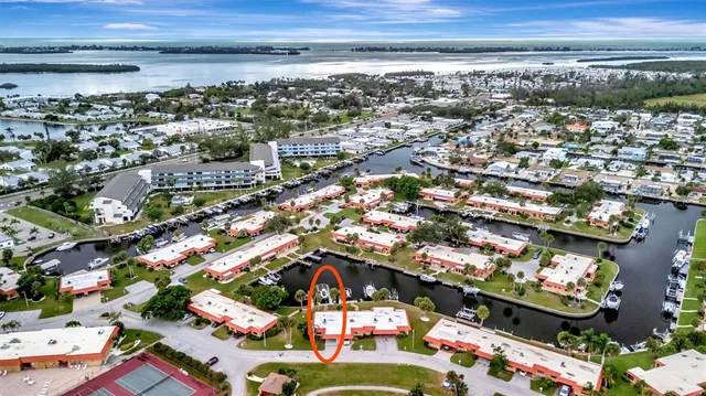 a view of a patio with table and chairs and potted plants