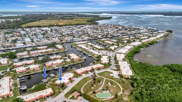 a swimming pool with outdoor seating and garden