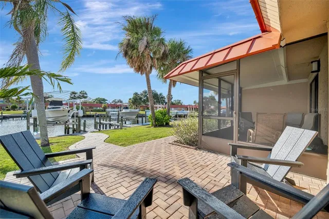 a bedroom with a bed a mirror and a flat screen tv
