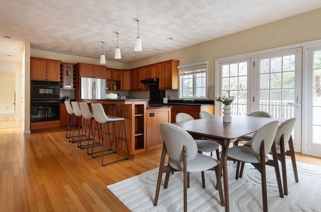 21 Bryant Road Lexington, MA 02420 - Photo 15 of 33 a view of a dining room with furniture window and wooden floor