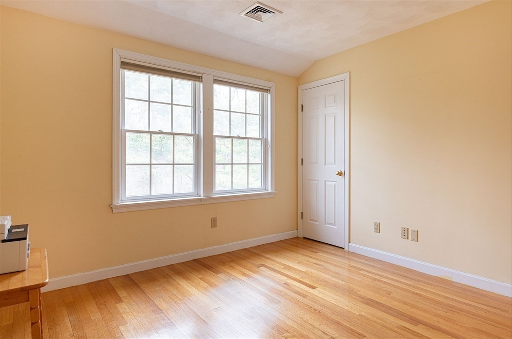 21 Bryant Road Lexington, MA 02420 - Photo 25 of 33 an empty room with wooden floor and windows