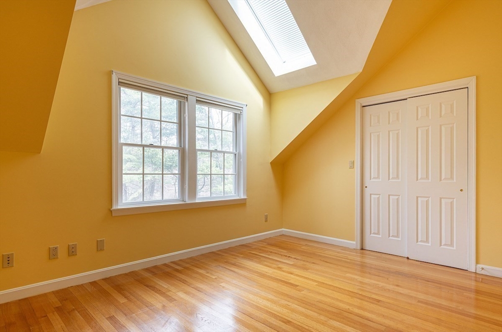 21 Bryant Road Lexington, MA 02420 - Photo 26 of 33 a view of an empty room with wooden floor and a window