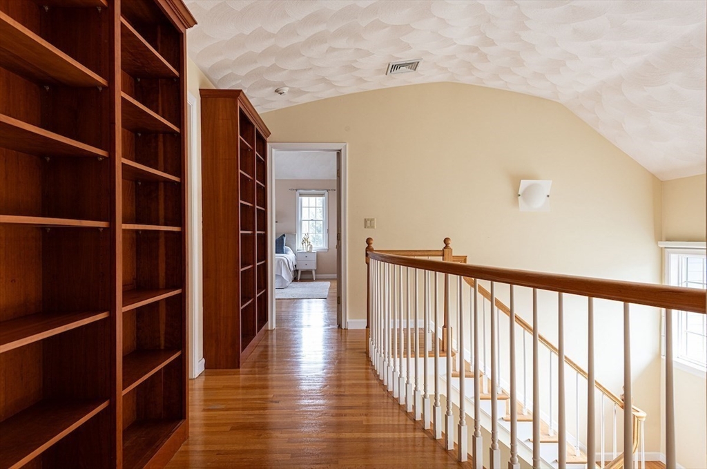 21 Bryant Road Lexington, MA 02420 - Photo 27 of 33 a view of a hallway with wooden floor and a window