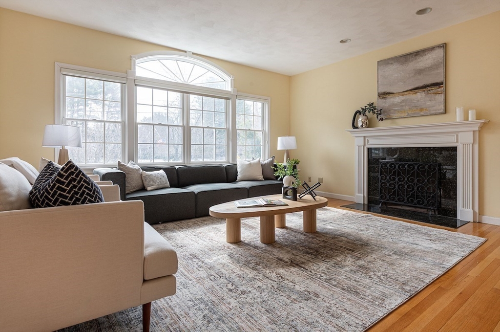 21 Bryant Road Lexington, MA 02420 - Photo 7 of 33 a living room with furniture windows and a fireplace