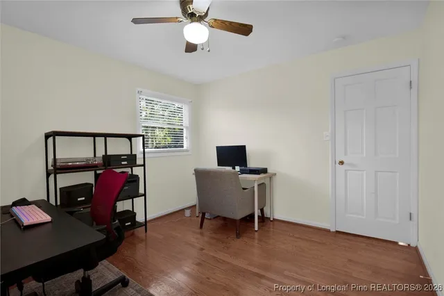 a work room with furniture and a window