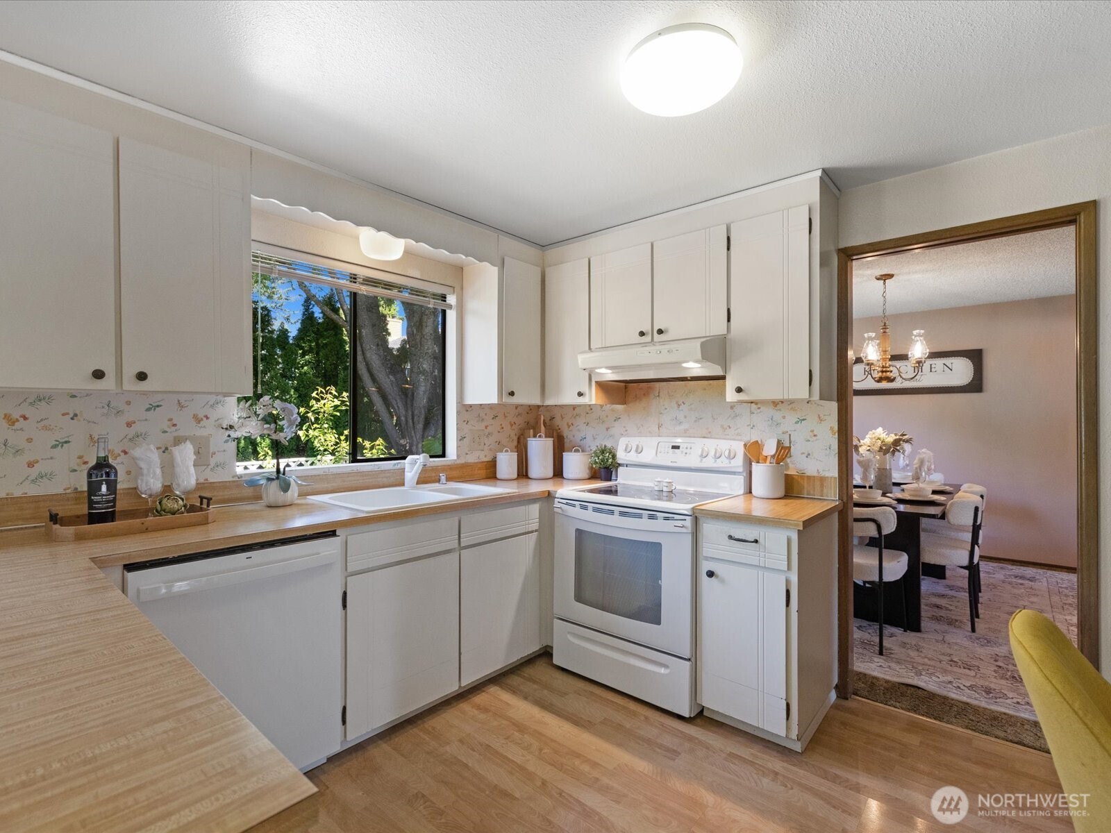 12314 Northeast 162nd Street Bothell, WA 98011 - Photo 11 of 39 a kitchen that has a sink and a stove in it