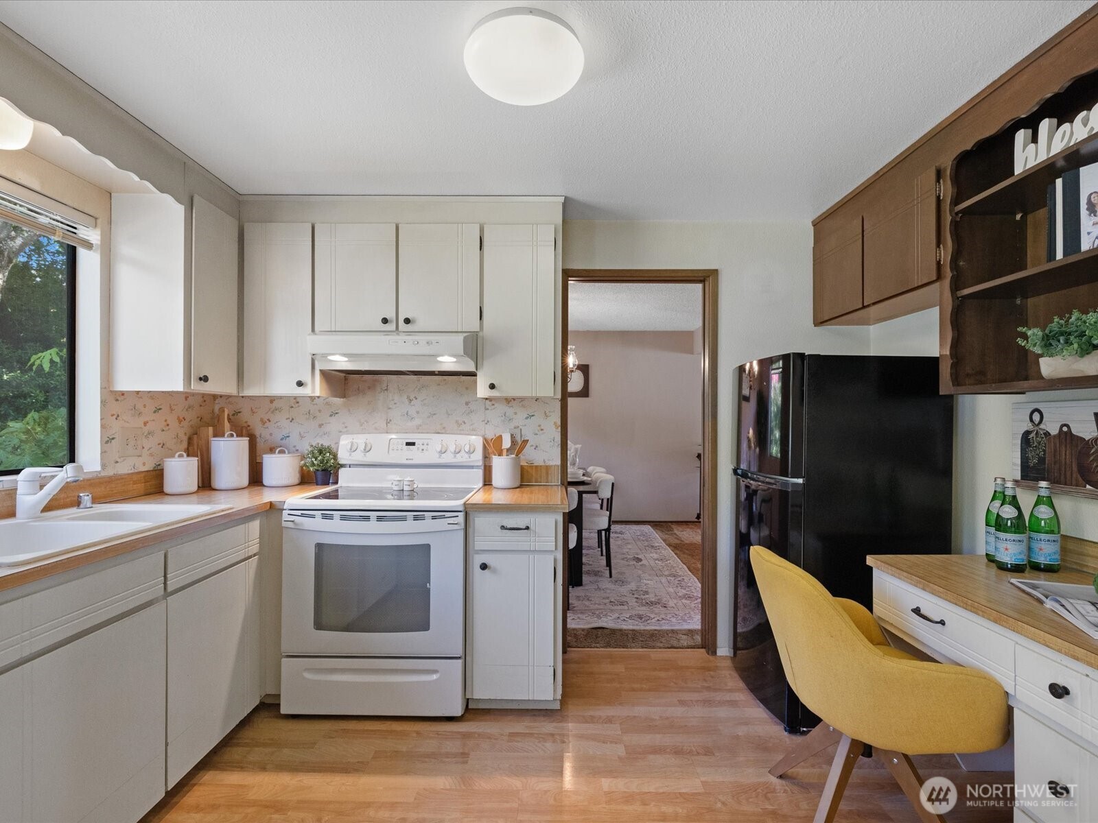 12314 Northeast 162nd Street Bothell, WA 98011 - Photo 12 of 39 a kitchen with a sink cabinets and stainless steel appliances