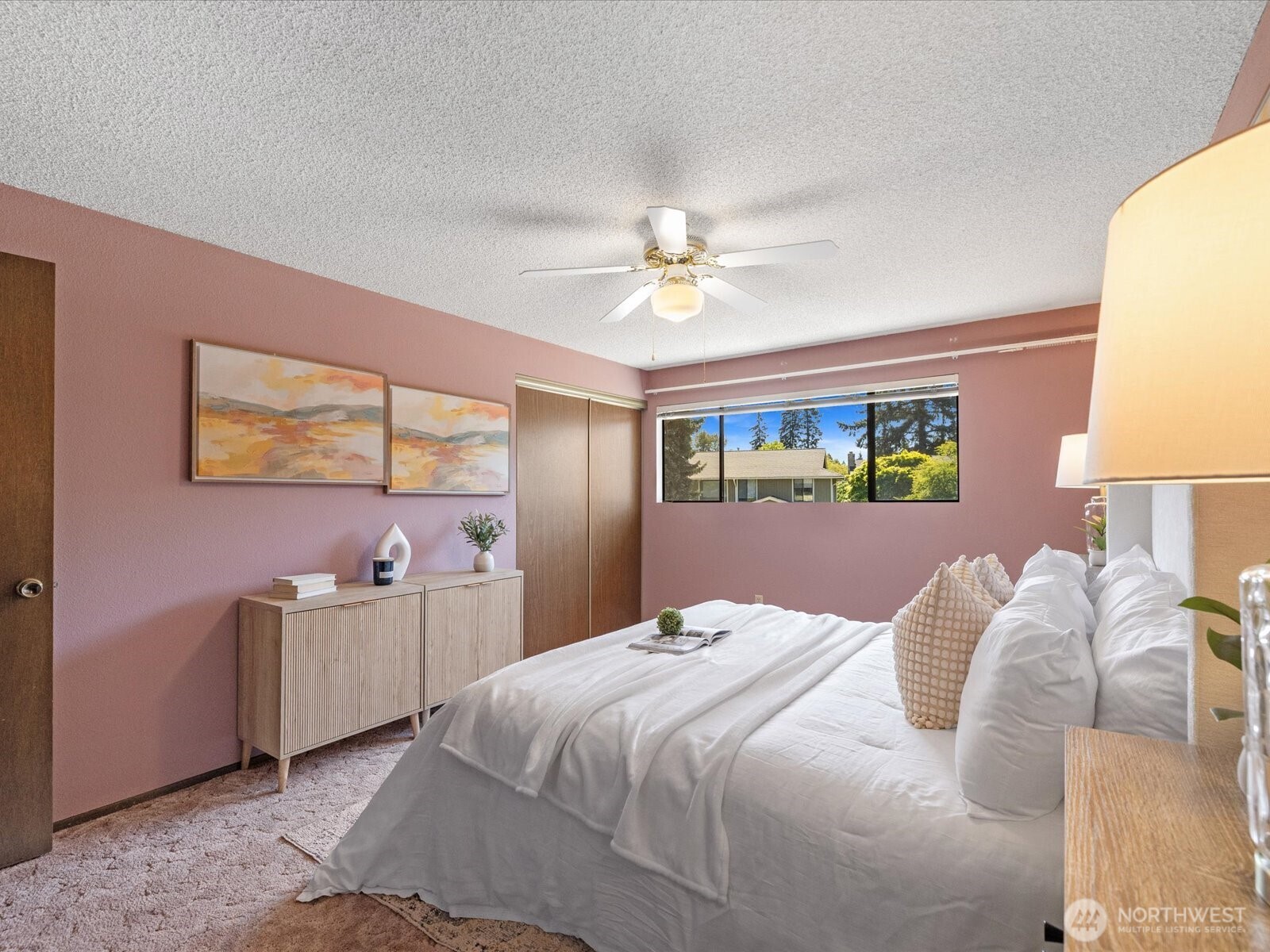 12314 Northeast 162nd Street Bothell, WA 98011 - Photo 24 of 39 a bedroom with a bed and a chandelier