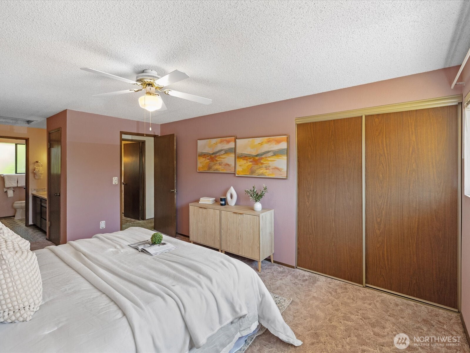 12314 Northeast 162nd Street Bothell, WA 98011 - Photo 25 of 39 a bedroom with a bed and a chandelier