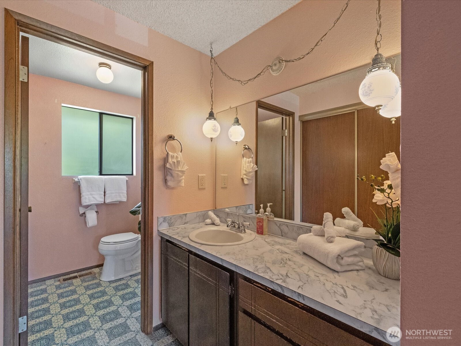 12314 Northeast 162nd Street Bothell, WA 98011 - Photo 26 of 39 a bathroom with a granite countertop sink a toilet and a mirror