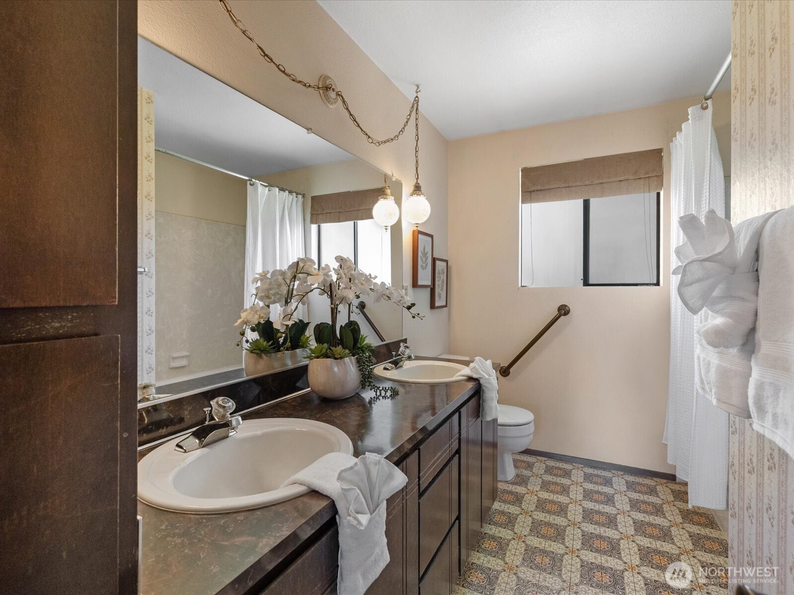 12314 Northeast 162nd Street Bothell, WA 98011 - Photo 28 of 39 a bathroom with a sink a mirror and a shower