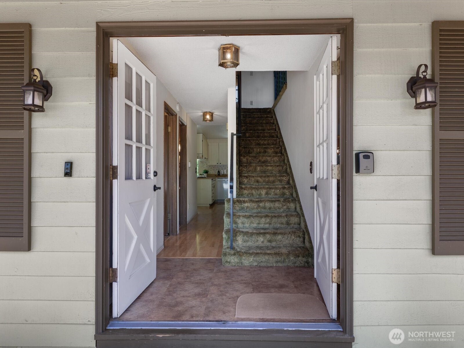 12314 Northeast 162nd Street Bothell, WA 98011 - Photo 4 of 39 a view of a hallway with a wooden floor and entryway