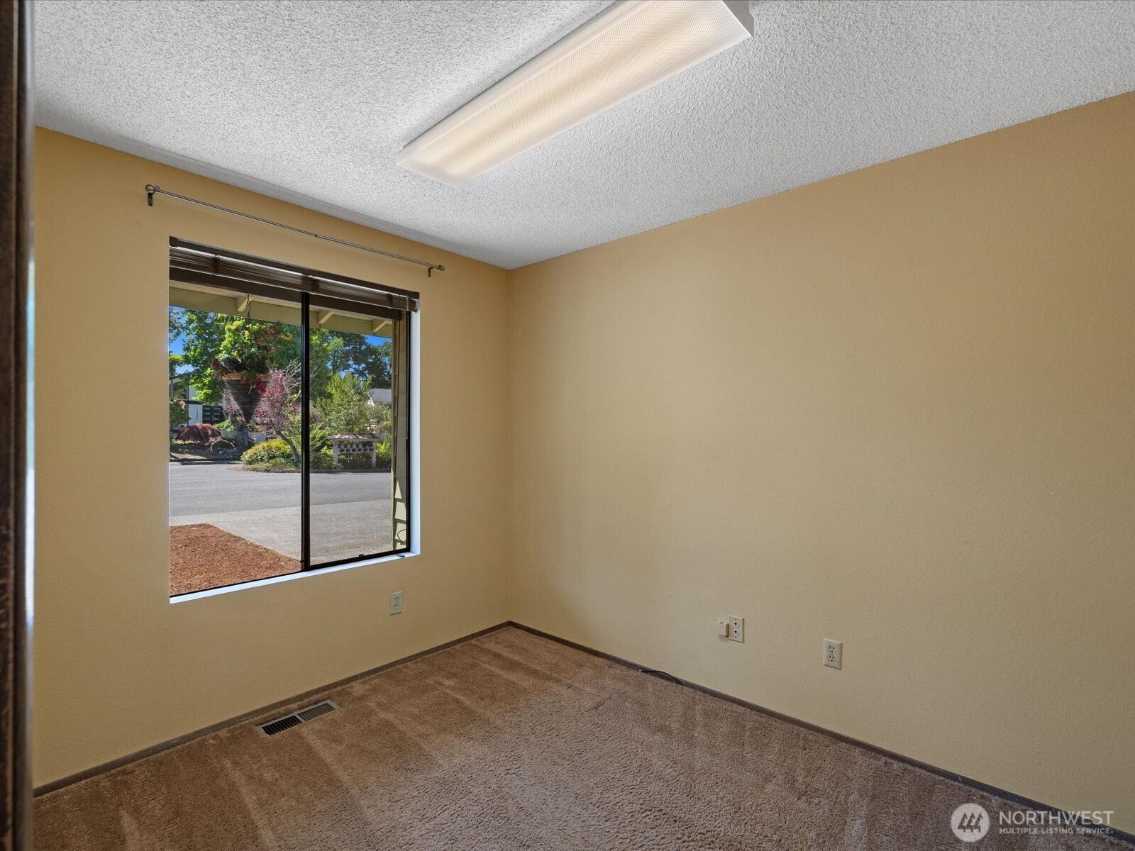 12314 Northeast 162nd Street Bothell, WA 98011 - Photo 5 of 39 an empty room with a window