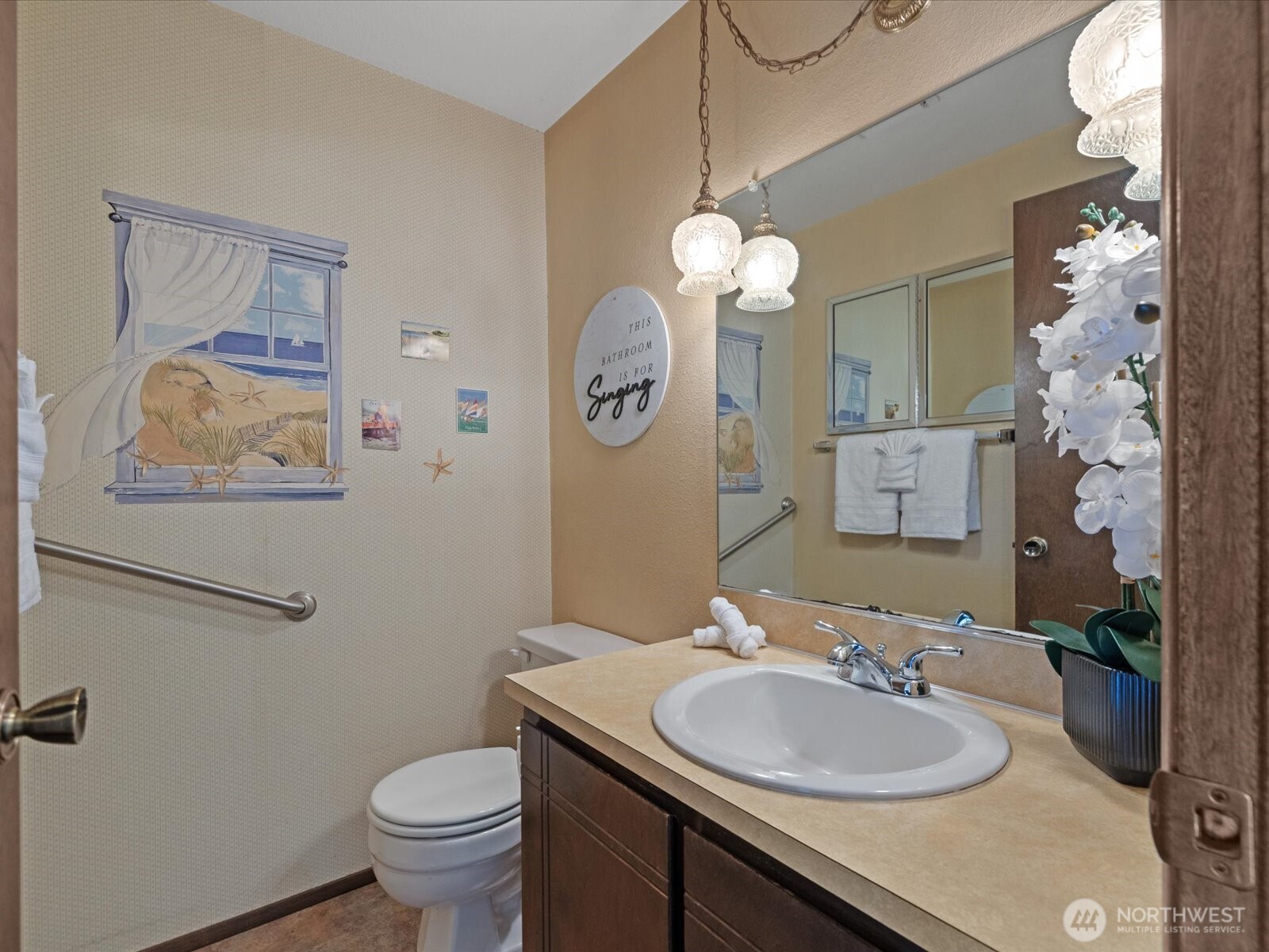 12314 Northeast 162nd Street Bothell, WA 98011 - Photo 6 of 39 a bathroom with a toilet a sink and a mirror