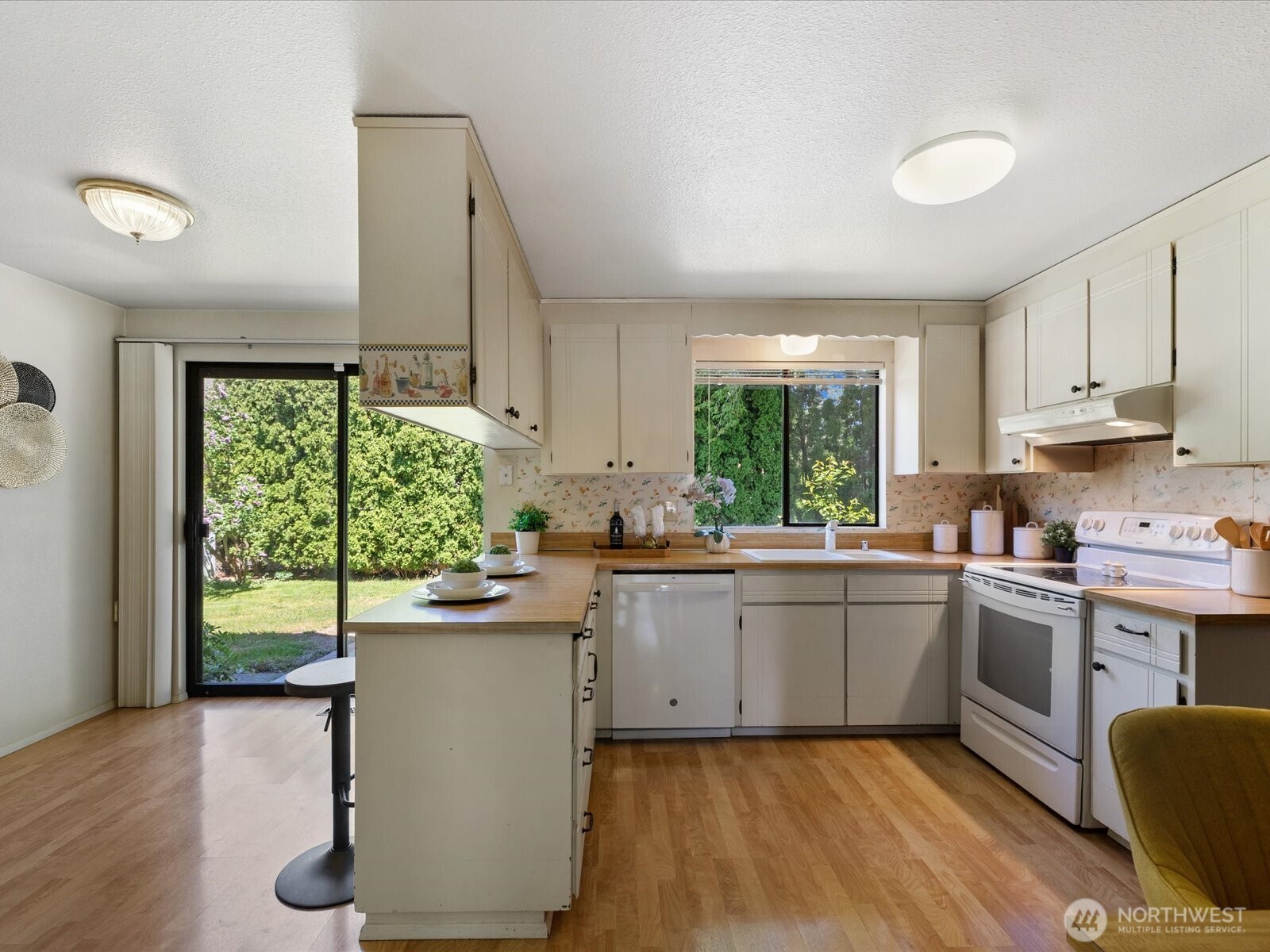 12314 Northeast 162nd Street Bothell, WA 98011 - Photo 7 of 39 a kitchen with a sink window and cabinets
