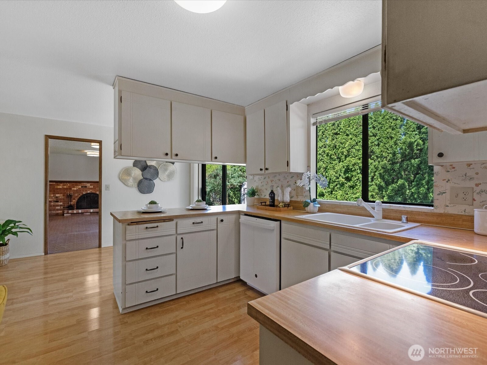 12314 Northeast 162nd Street Bothell, WA 98011 - Photo 9 of 39 a kitchen with a sink window and cabinets
