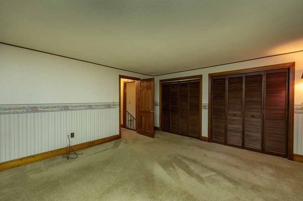 658 Middle Road Acushnet, MA 02743 - Photo 18 of 32 a view of an empty room with wooden floor