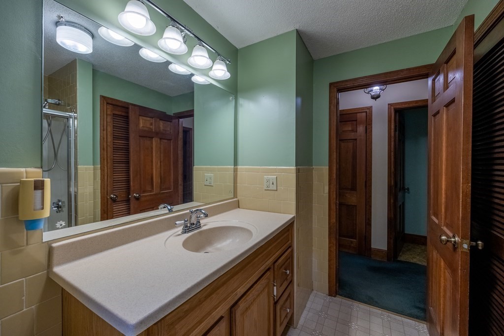 658 Middle Road Acushnet, MA 02743 - Photo 19 of 32 a bathroom with a sink double vanity and a mirror
