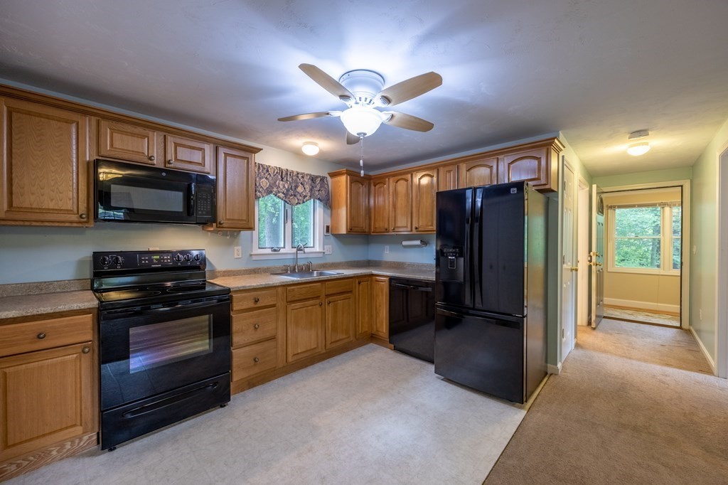 658 Middle Road Acushnet, MA 02743 - Photo 24 of 32 a kitchen with stainless steel appliances granite countertop a refrigerator and a stove top oven