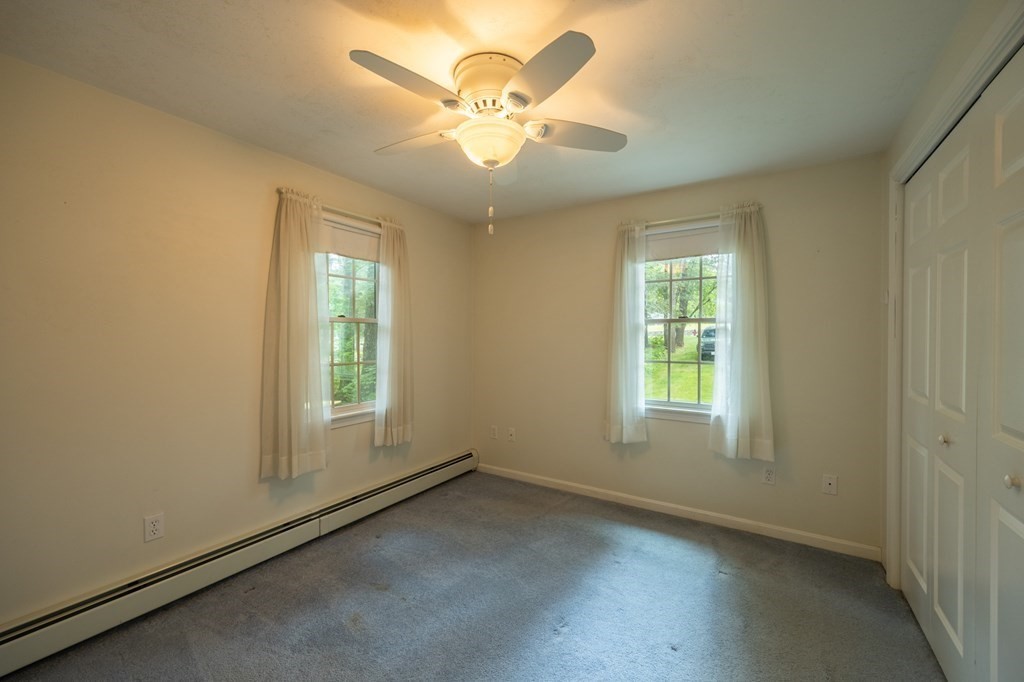 658 Middle Road Acushnet, MA 02743 - Photo 25 of 32 an empty room with windows and fan