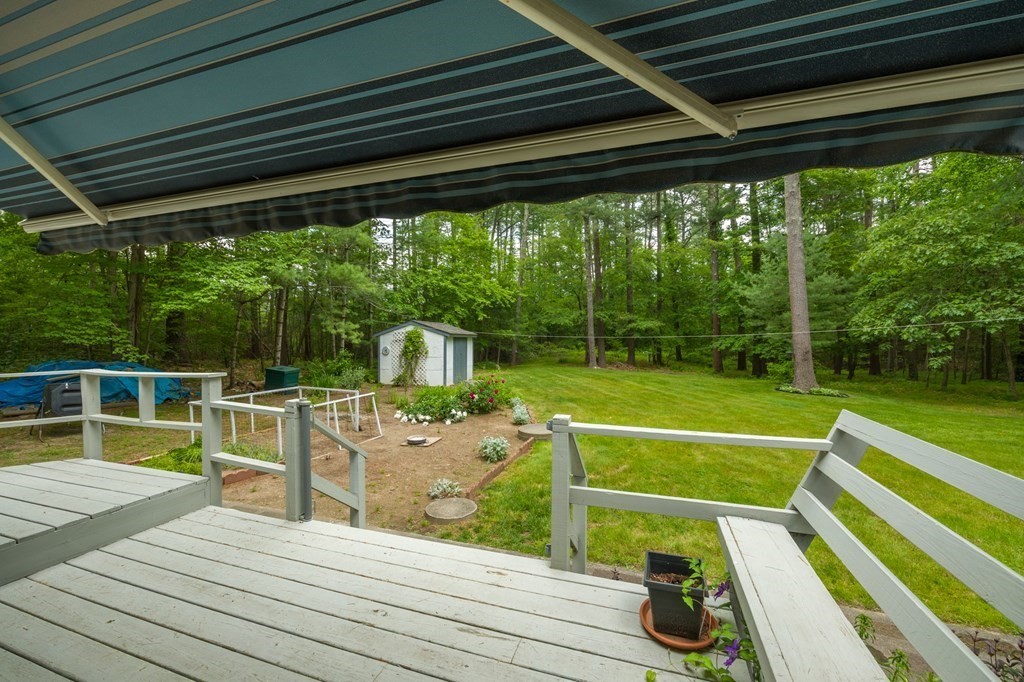 658 Middle Road Acushnet, MA 02743 - Photo 7 of 32 a view of a chairs and table on the wooden deck
