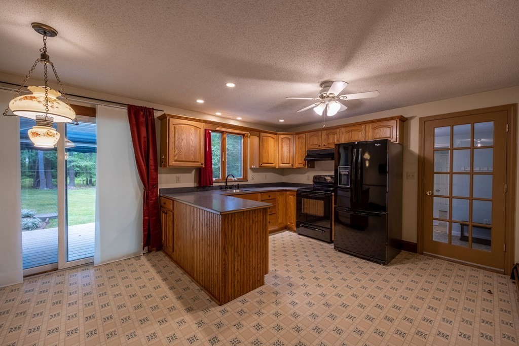 658 Middle Road Acushnet, MA 02743 - Photo 8 of 32 a kitchen with stainless steel appliances granite countertop a refrigerator and a sink