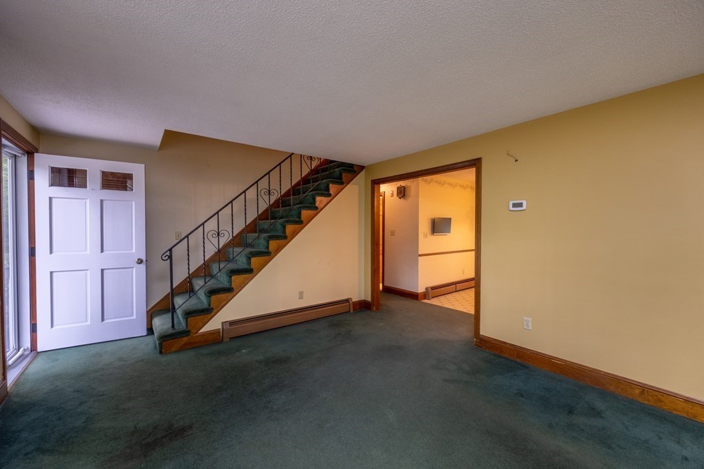 658 Middle Road Acushnet, MA 02743 - Photo 10 of 32 a view of an empty room with stairs