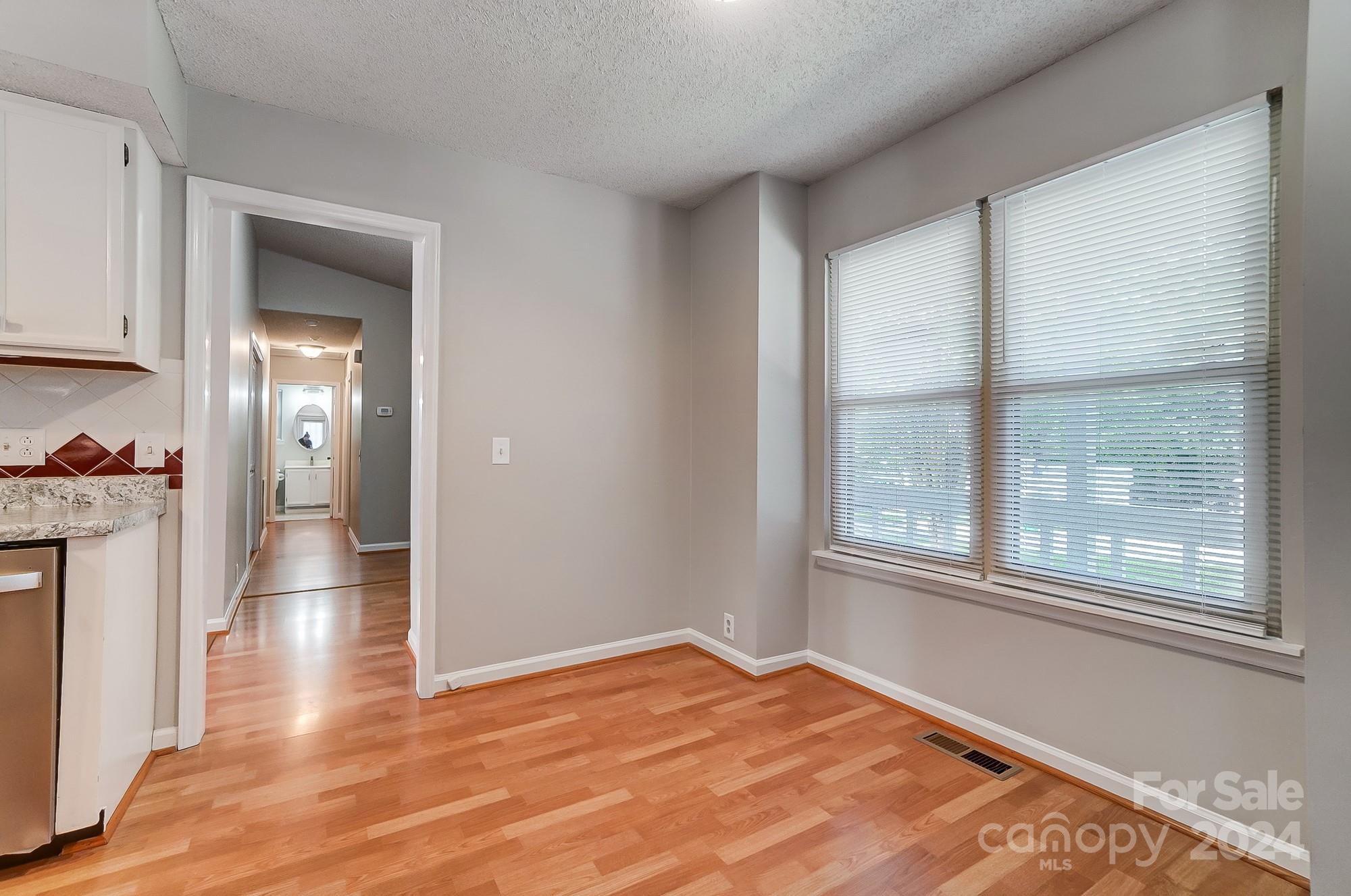 6510 Patchwork Circle Charlotte, NC 28270 - Photo 18 of 48 a view of empty room with wooden floor and fan