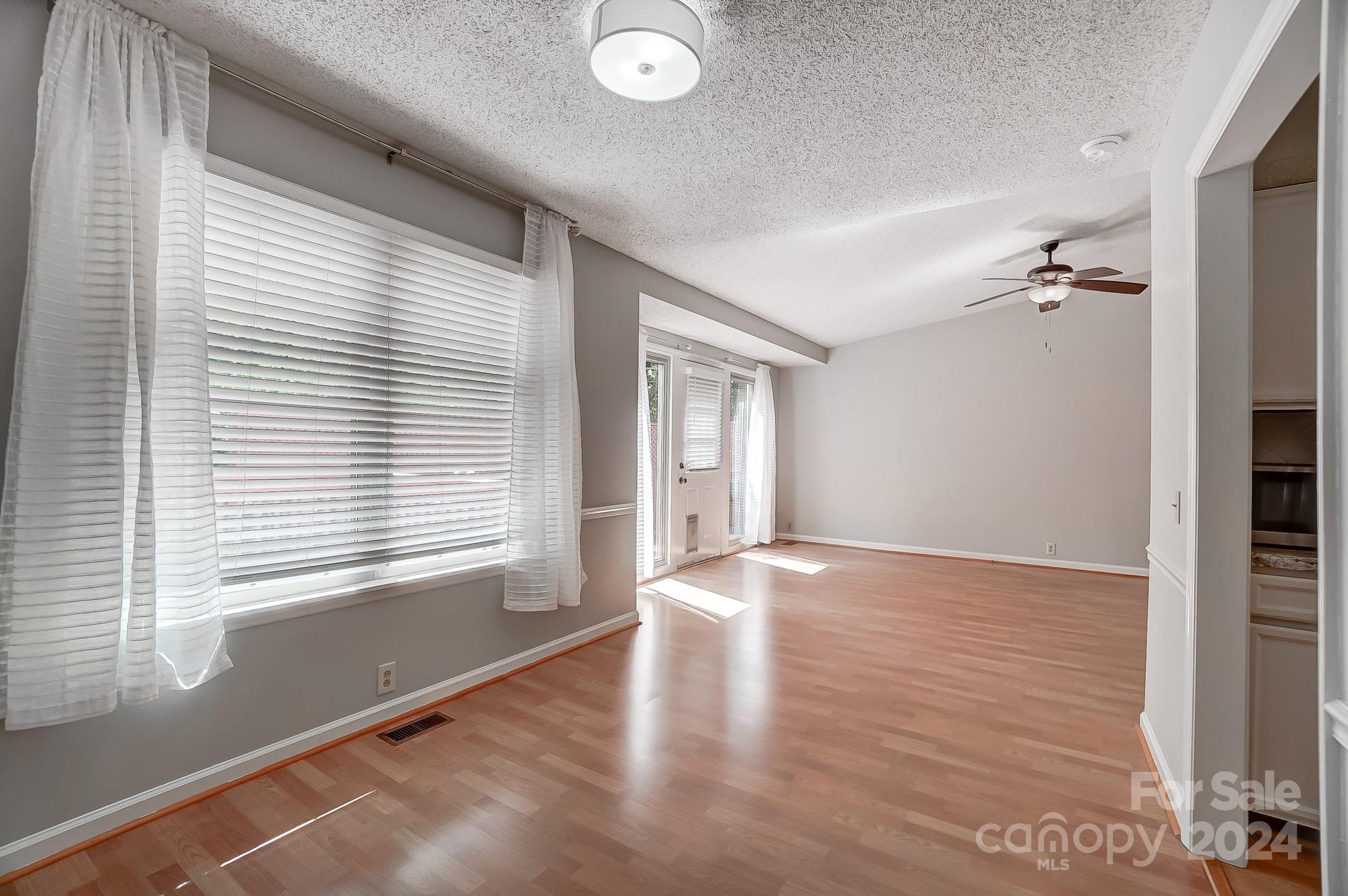 6510 Patchwork Circle Charlotte, NC 28270 - Photo 22 of 48 a view of an empty room with wooden floor and a window